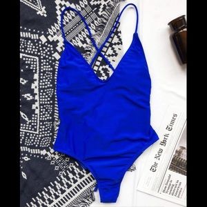 New swimsuit. Bright blue one piece swimsuit